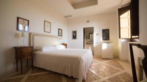 Posteľ alebo postele v izbe v ubytovaní Palazzo Viceconte
