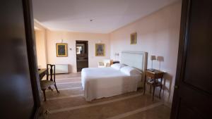 Posteľ alebo postele v izbe v ubytovaní Palazzo Viceconte