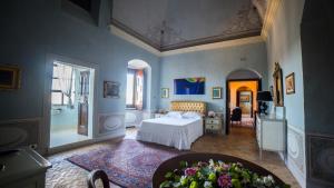 Posteľ alebo postele v izbe v ubytovaní Palazzo Viceconte
