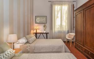 Postel nebo postele na pokoji v ubytování Villa Ricci Suites