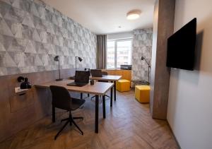 an office with a desk with a laptop on it at Urban Ring Hotel in Ljubljana