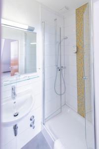 Koupelna v ubytování Hotel Aigner