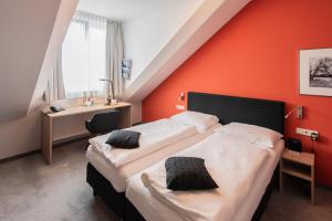 Postel nebo postele na pokoji v ubytování Hotel Aigner