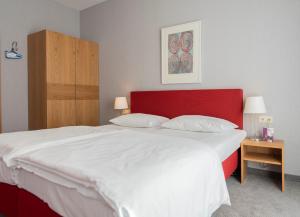 Postel nebo postele na pokoji v ubytování Hotel Aigner