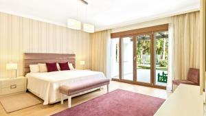 Cama ou camas em um quarto em Villa Marina