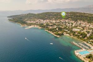 a hot air balloon flying over a body of water at Hotel Cvita in Split