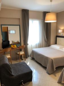 Posteľ alebo postele v izbe v ubytovaní Hotel Di Stefano
