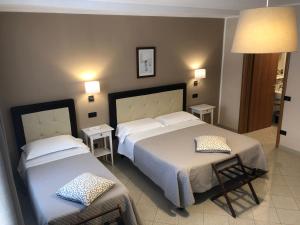 Posteľ alebo postele v izbe v ubytovaní Hotel Di Stefano
