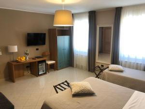 Posteľ alebo postele v izbe v ubytovaní Hotel Di Stefano