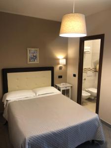Posteľ alebo postele v izbe v ubytovaní Hotel Di Stefano