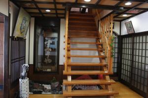 a room with a staircase in a house at Sumiyoshiya in Kanazawa