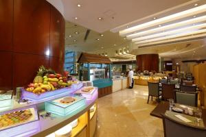 a lobby of a hotel with fruit on a counter at B P International in Hong Kong
