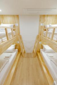 Ein Bett oder Betten in einem Zimmer der Unterkunft Step Inn Myeongdong 1