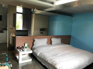 Postel nebo postele na pokoji v ubytování One Piece B&B