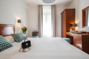 Postel nebo postele na pokoji v ubytování Hotel Olympia + 24 fotografií
