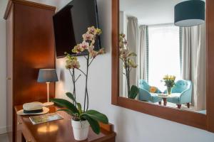 TV a/nebo společenská místnost v ubytování Hotel Olympia