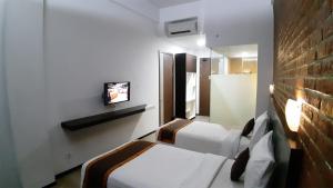 TV a/nebo společenská místnost v ubytování Xtra Hotel Bengkulu