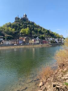 a town sitting on top of a hill next to a river at Gästehaus Gute Quelle in Cochem