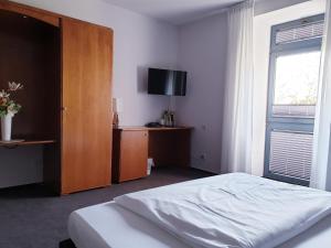 Postel nebo postele na pokoji v ubytování Hotel Moritz an der Elbe