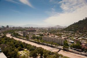 an aerial view of a city with a river at Chilean Suites Providencia in Santiago