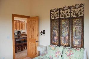 a room with a bed with a large headboard at Stone Canyon Inn in Tropic