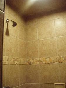 a bath room with a shower and a toilet at Stone Canyon Inn in Tropic
