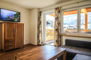 Televízia a/alebo spoločenská miestnosť v ubytovaní Tauern Relax Lodges by we rent, SUMMERCARD INCLUDED