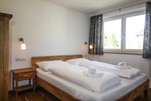 Posteľ alebo postele v izbe v ubytovaní Tauern Relax Lodges by we rent, SUMMERCARD INCLUDED