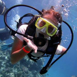 a person with a camera in the water at Posada del Mirador Italyan Villa in San Bartolo