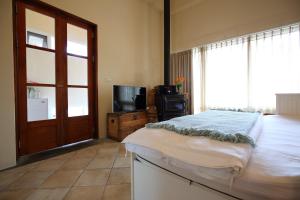Rúm í herbergi á Focaccia Manor B&B