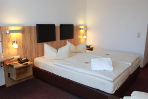 Postel nebo postele na pokoji v ubytování Hotel Promenade + 31 fotografií