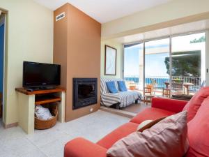 A television and/or entertainment centre at Apartment El Niu by Interhome