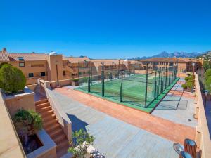 a tennis court in the middle of a courtyard at Apartment Pueblo Mascarat-2 by Interhome in Altea