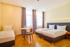 Postel nebo postele na pokoji v ubytování Hotel Apfelbaum