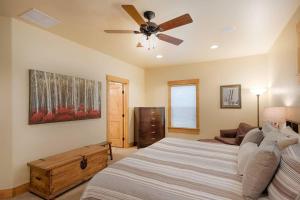 a bedroom with a bed and a ceiling fan at TJ'S MOUNTAIN HAUS by Casago McCall - Donerightmanagement in McCall