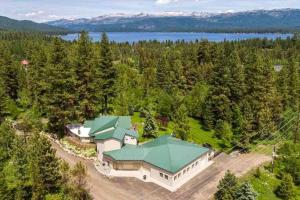 an aerial view of a large house with a green roof at Seasons at McCall by Casago McCall - Donerightmanagement in McCall