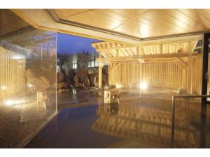 a swimming pool in a house with a pool at Tazawako Lake Resort & Onsen / Vacation STAY 78940 in Senboku