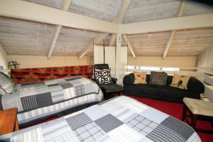 a living room with two beds and a couch at SIerra Park Villas #06 in Mammoth Lakes