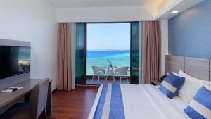 Letto o letti in una camera di Arena Beach Hotel