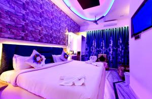 Aman Homestay, A Boutique Hotel客房内的一张或多张床位