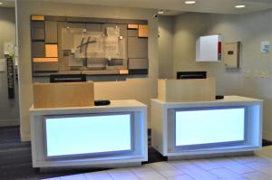 two boxes sitting on the floor in a room at Holiday Inn Express & Suites Batesville, an IHG Hotel in Batesville