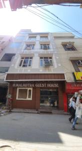a building with a guest house in front of it at Malhotra Guest House 50 Meter from Golden Temple in Amritsar