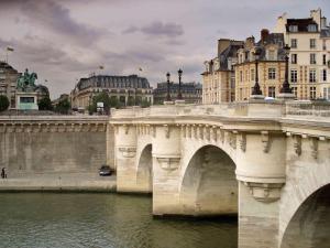 a bridge over a river in a city with buildings at ibis Paris Canal Saint Martin in Paris