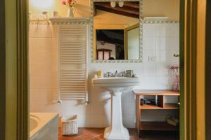 a bathroom with a sink and a mirror at Villa Casavecchia in San Casciano in Val di Pesa +62 photos