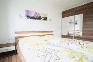 Posteľ alebo postele v izbe v ubytovaní Apartment Sunshine