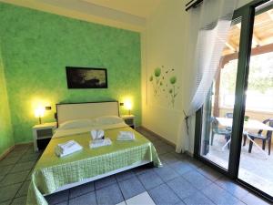 Postel nebo postele na pokoji v ubytování Hotel Alba Chiara Sant'Andrea Salento