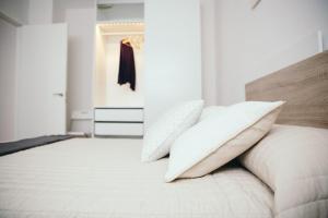A bed or beds in a room at Estilo nordico Sardinero
