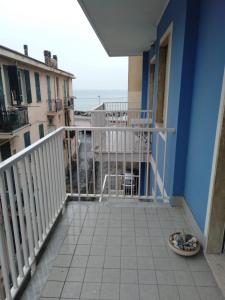 a balcony with a view of the ocean at Azzurra casa vacanza in Ventimiglia