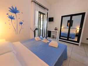 Postel nebo postele na pokoji v ubytování Hotel Alba Chiara Sant'Andrea Salento