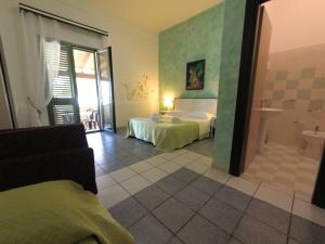 Postel nebo postele na pokoji v ubytování Hotel Alba Chiara Sant'Andrea Salento